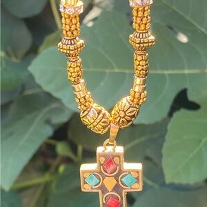 Handmade Black Corded Cross Necklace With Golds, Blues and Reds.  16”